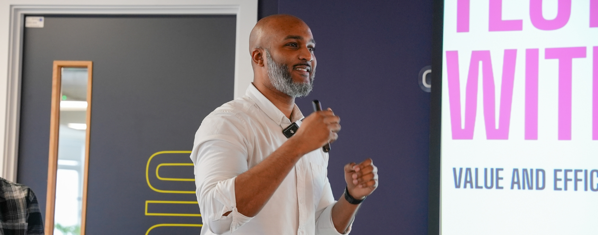 Dré Picart delivering a keynote on AI and marketing